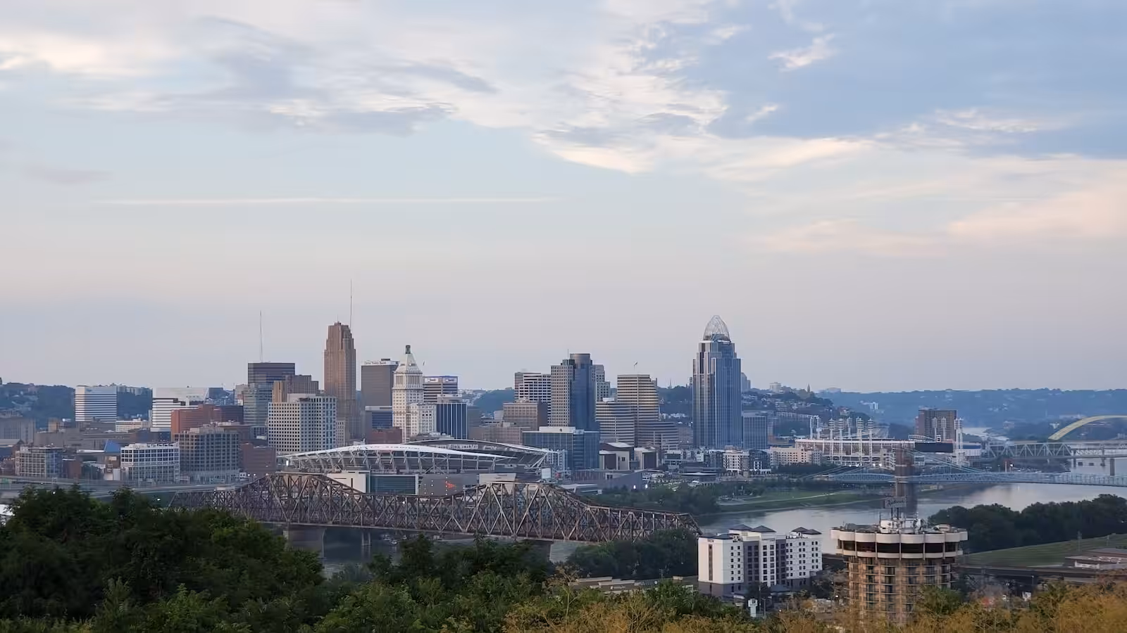 a view of a city with a bridge in the foreground