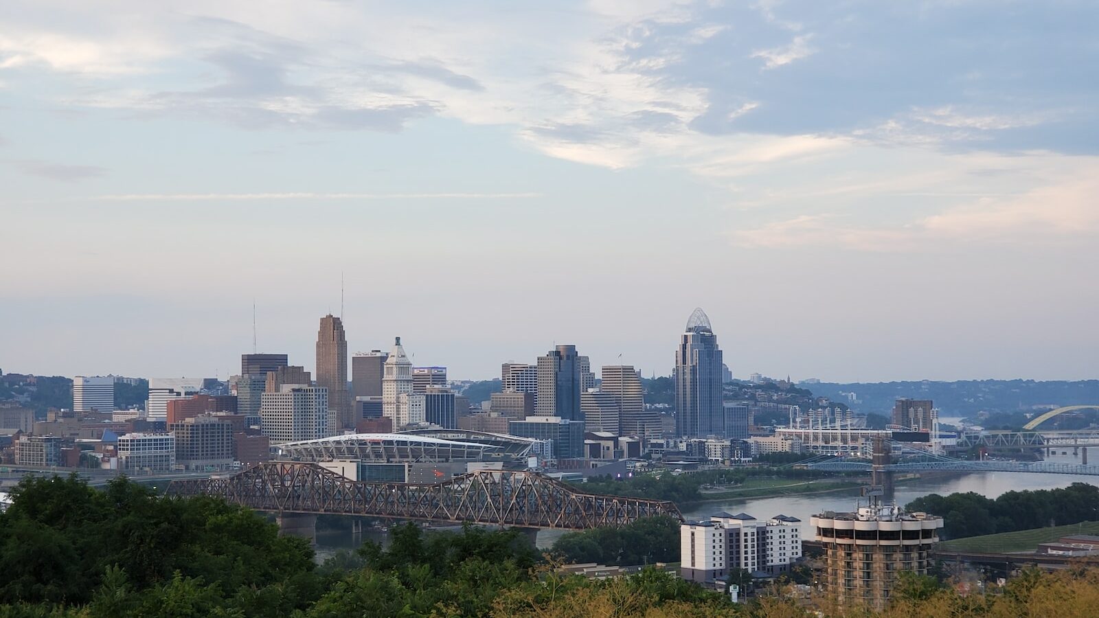 a view of a city with a bridge in the foreground